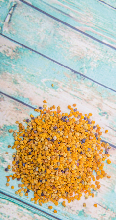 Bee pollen over wooden background