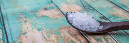 Sea salt over wooden backgroundの写真素材