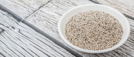 White chia seed in white bowl over wooden backgroundの写真素材