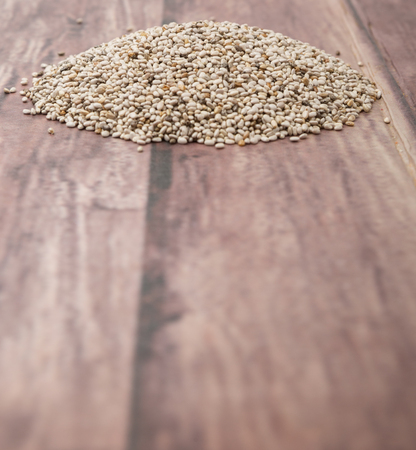 White chia seed over wooden backgroundの写真素材