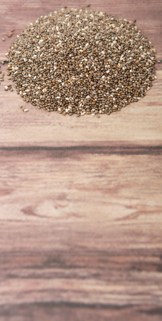 Dried black chia seed over wooden backgroundの写真素材