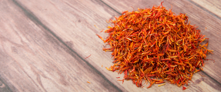 Dried safflower over wooden backgroundの写真素材