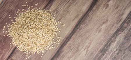 White quinoa grain over wooden backgroundの写真素材