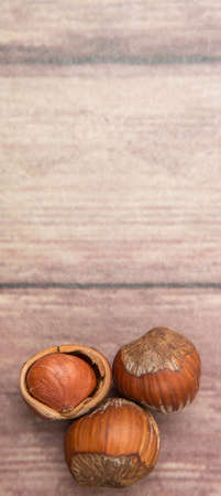 Hazelnuts on wooden backgroundの写真素材