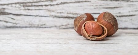 Hazelnuts on wooden backgroundの写真素材