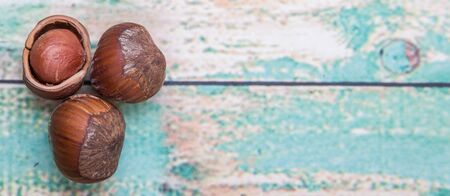 Hazelnuts on wooden background