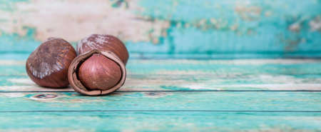 Hazelnuts on wooden backgroundの写真素材