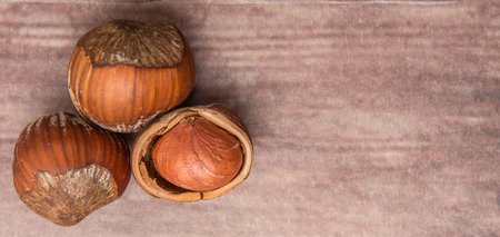 Hazelnuts on wooden backgroundの写真素材