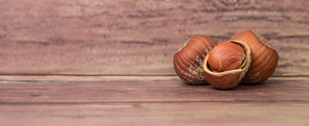Hazelnuts on wooden backgroundの写真素材