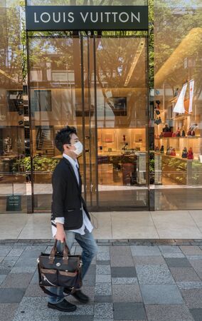 TOKYO, JAPAN - MAY 3RD, 2016. Exterior of a Louis Vuitton designer store in Omotesando, an upscale shopping district in Tokyo.のeditorial素材