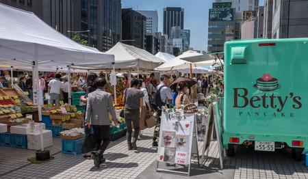 TOKYO, JAPAN - MAY 7TH, 2016. Weekly held local farmer's market at United Nations University, Tokyo, Japan.のeditorial素材