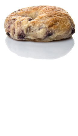 Homemade blueberry bagel over white backgroundの写真素材