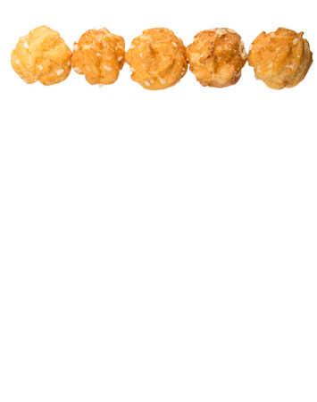 Choux pastry sprinkled with sugar over white background