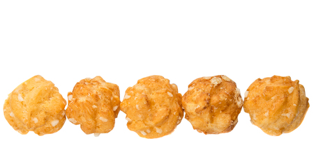 Choux pastry sprinkled with sugar over white background