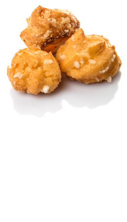 Choux pastry sprinkled with sugar over white backgroundの写真素材