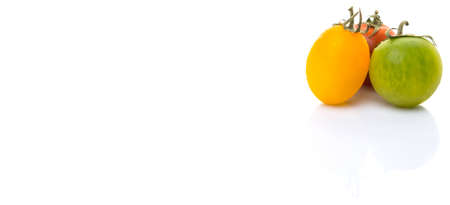 Colorful cherry tomatoes over white backgroundの写真素材