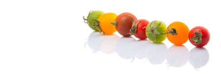 Colorful cherry tomatoes over white backgroundの写真素材
