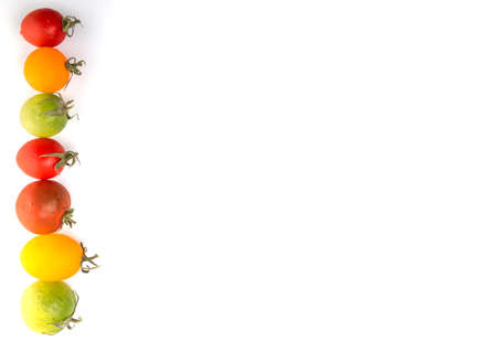 Colorful cherry tomatoes over white backgroundの写真素材