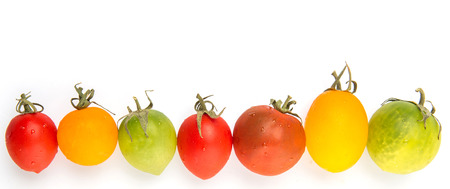 Colorful cherry tomatoes over white backgroundの写真素材