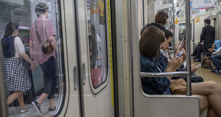 TOKYO, JAPAN - MAY 14TH 2016. Tokyo Metro subway scene. Tokyo Metro subway is a popular mode of transportation in Tokyo for people to commute.のeditorial素材