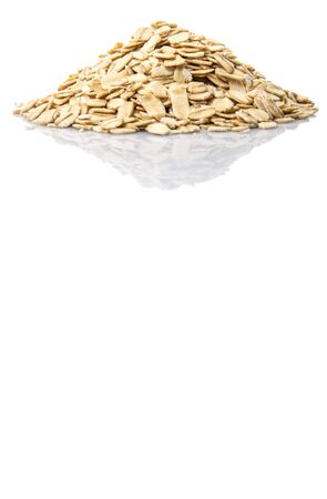 Raw oatmeal over white backgroundの写真素材