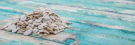 Raw oatmeal over wooden backgroundの写真素材