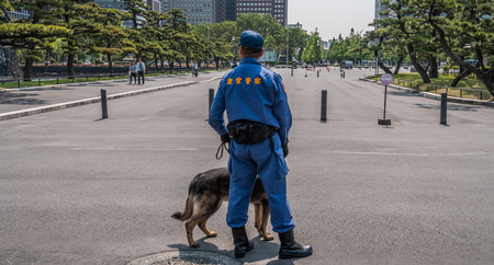 TOKYO, JAPAN - MAY 21ST, 2016. Security police at the Tokyo Imperial Palace grounds.のeditorial素材