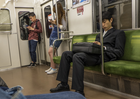 TOKYO, JAPAN - MAY 14TH 2016. Tokyo Metro subway scene. Tokyo Metro subway is a popular mode of transportation in Tokyo for people to commute.のeditorial素材