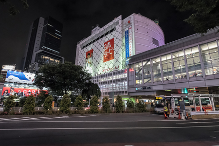 TOKYO, JAPAN - MAY 21ST, 2016. Crowd of people at the popular Shibuya Crossing junction at night time. Shibuya is a popular shopping district in Tokyo, Japan.のeditorial素材