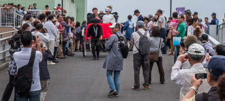 ITAKO, IBARAKI, JAPAN - JUNE 4TH 2016. Japanese bride and groom in traditional costume in rickshaw during the annual Suigi Itako Iris Flower Festival.のeditorial素材