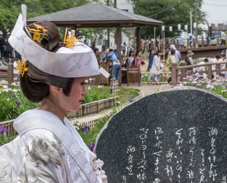 ITAKO, IBARAKI, JAPAN - JUNE 4TH 2016. Japanese bride in traditional costume during the annual Suigo Itako Iris Flower Festival.のeditorial素材