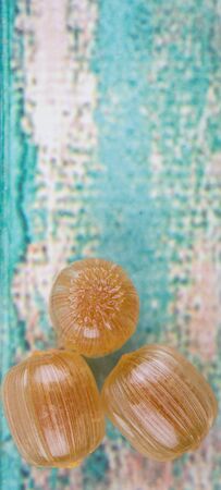 Japanese caramel honey hard candy over wooden backgroundの写真素材