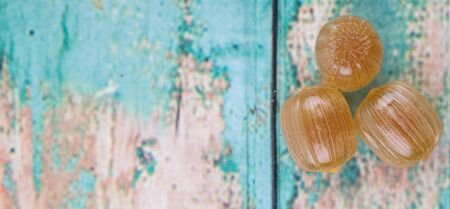 Japanese caramel honey hard candy over wooden backgroundの写真素材