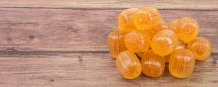 Japanese caramel honey hard candy over wooden backgroundの写真素材