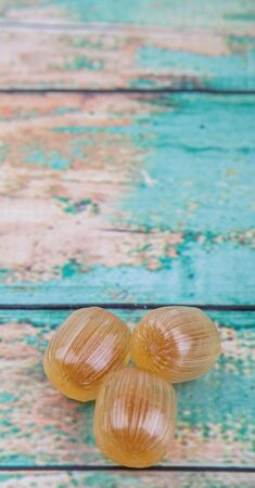 Japanese caramel honey hard candy over wooden backgroundの写真素材