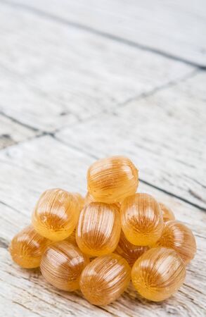 Japanese caramel honey hard candy over wooden backgroundの写真素材