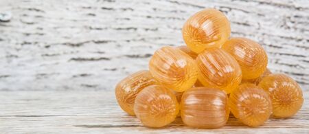 Japanese caramel honey hard candy over wooden backgroundの写真素材