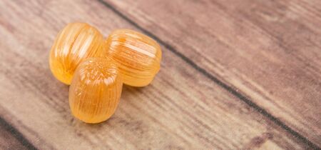 Japanese caramel honey hard candy over wooden background