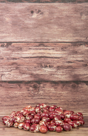 Pinto beans or speckled beans over wooden backgroundの写真素材