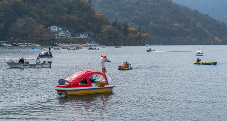 NIKKO, JAPAN - OCTOBER 23RD, 2016. Locals and tourist enjoying leisure boating activities at Lake Chuzenji. Nikko is the main tourist destination for locals and foreign tourist in Japanのeditorial素材