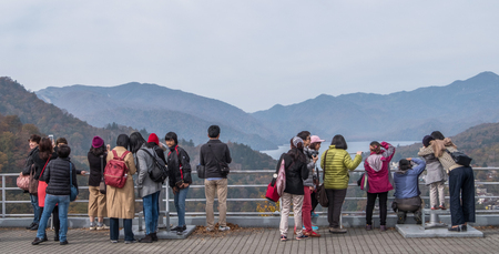 NIKKO, JAPAN - OCTOBER 22ND, 2016. Tourist enjoying the view at Nikko National Park, Japan. Nikko is the main tourist destination for locals and foreign tourist in Japan.のeditorial素材