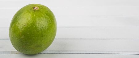 Fresh lime fruit over wooden background