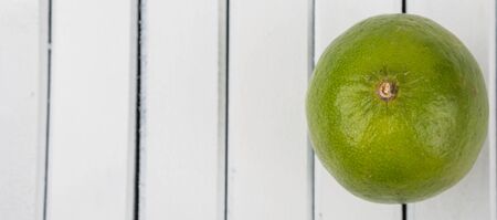 Fresh lime fruit over wooden background
