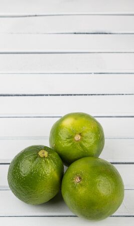 Fresh lime fruit over wooden backgroundの写真素材