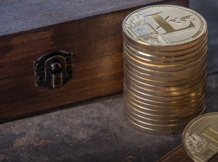 Litecoin with leather wallet on wooden table topの写真素材
