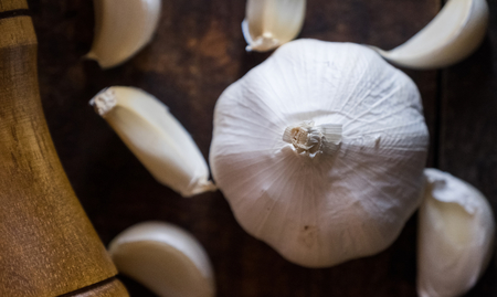 Garlic cloves on wooden boardの写真素材