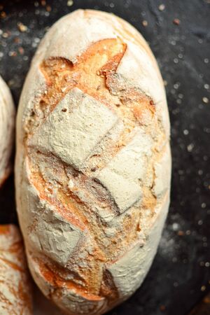 Bakery products. Crispy, beautiful bread on a dark background. Buckwheat, without yeast, wheat bread...