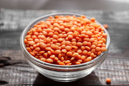 Red lentils in a glass bowl. Raw lentils.の写真素材