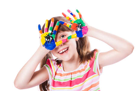 girl with hands in paintの写真素材