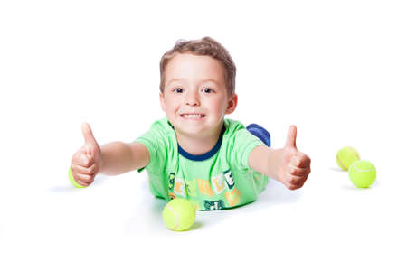 boy catches the ball on a white backgroundの写真素材